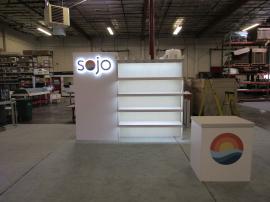 Custom Inline Exhibit with Backlit Halo Logos, Pergola with Shelves, and Custom Counter with LED Halo Lights