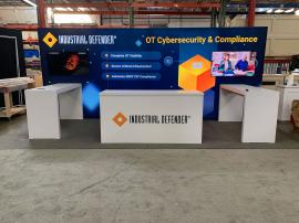 RENTAL: RE-2110 Inline Design with 232" W x 96" H Single-Sided Lightbox, (2) Large Monitor Mounts, (2) 50" Monitors, (2) RE-1579 Genius Bars, RE-1207 Large Rectangular Counter, SEG Backlit Fabric Graphics, and Direct Print Sintra Graphic